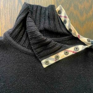 Burberry Black Turtleneck Sweater.Burberry Plaid Trim at Neck & Snap Buttons.